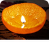 Vela con cáscara de naranja